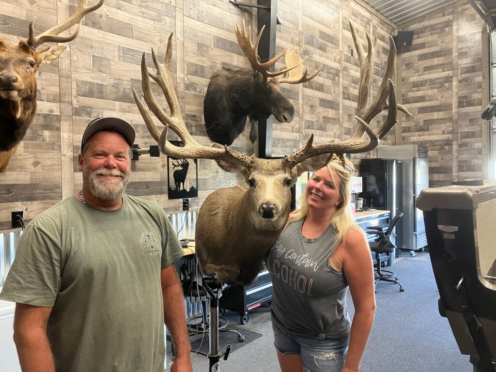 Doug and Laura showing their taxidermy work