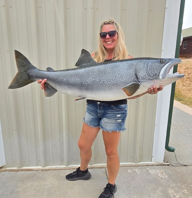 Laura with a large lake trout Fish